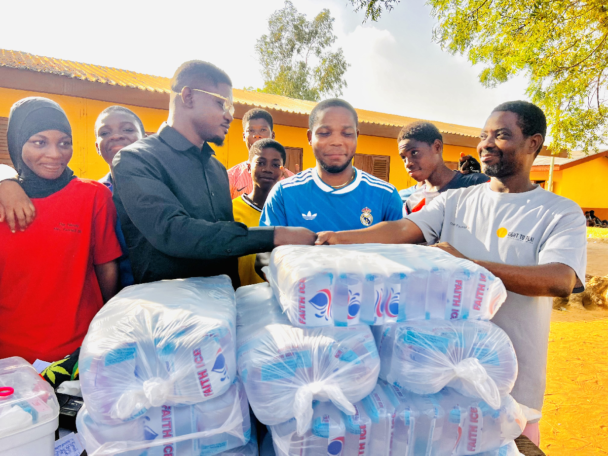 Ahovi Harry donates a set of jerseys and 20 bags of water to Hlevi D/A Basic School
