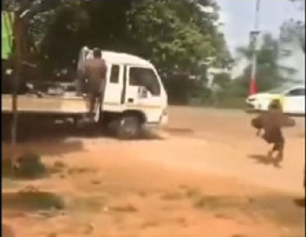 One of the executioners being chased by youth of Abesim in the white pickup truck