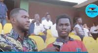 GhanaWeb's Benjamin Sackey (left) engaging a fan at the Accra Sports Stadium