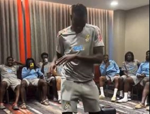 Benjamin Asare (standing) dancing in Black Stars camp