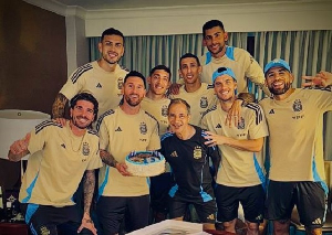 Messi with teammates and a technical staff