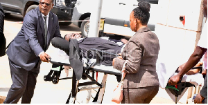 Mityana Municipality MP, being wheeled to the hospital after being beaten in Parliament