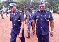 Mr Crentsil (left) being escorted by Mr Seidu Yakubu (right), Brong Ahafo Regional Commander of GRA