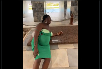 The said pregnant woman captured lying on the grave of Dr Kwame Nkrumah