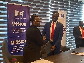 Head of Legal at BOST Madam Harriet Amoah and Education Minister Dr Yaw Osei Aduwtwum in shot