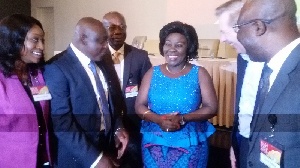 Mr. Kuuchi (2nd from left) interacting with the Minister, Ms. Dapaah (middle) with others looking on