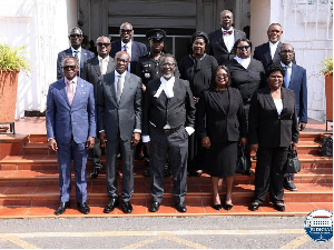 Justice Paul Baffoe-Bonnie together with Justice Edrissa M O Faal and other judicial staff