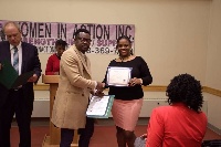 One of the trainees receiving her certificate for participation