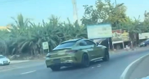 A picture of the Benz racing on a domestic road