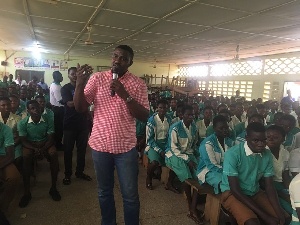 Actor John Dumelo addressing students of Ahafoman Secondary Technical