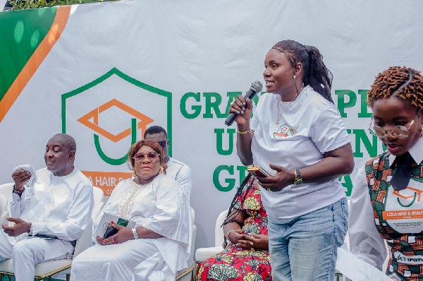 Reverend Latifa Adekanla (with mic) speaking at the event