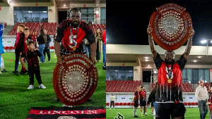 Ibrahim Ayew celebrating with the trophy