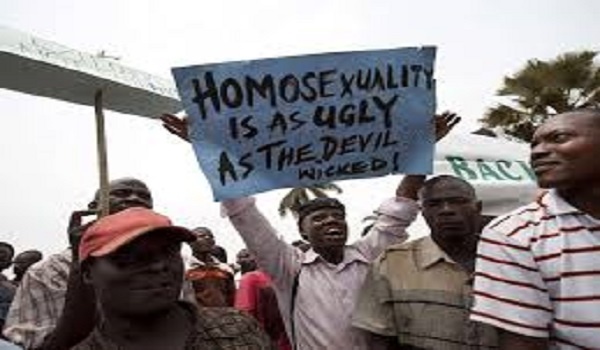 A file photo showing a man with a placard in Nigeria against homosexuality