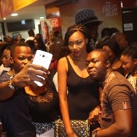 Yvonne Nelson in a selfie mode with movie fans