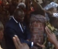 Asantehene Otumfuo  Osei Tutu in suits dancing  adowa