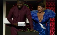 Actor John Dumelo with actress Zynell Zuh presenting an award at the VGMA