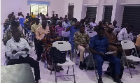 Participants seated at the Second Ordinary Sitting of the Third Session of the Kadjebi District Ass.