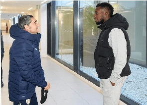 Inaki Williams chats with a club official