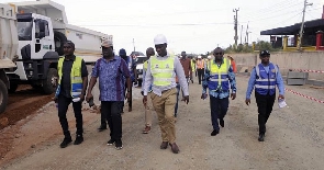 Kwasi Amoako-Attah inspected the progress of work at the site with others