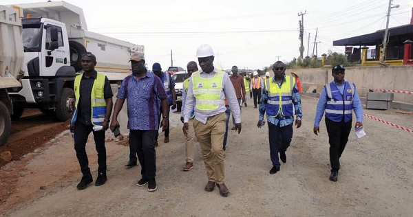 Kwasi Amoako-Attah inspected the progress of work at the site with others