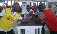 Two men in arm-wrestling battle.    File photo.