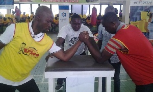 Two men in arm-wrestling battle.    File photo.