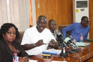 Mr. Asiedu (second from right), addressing the media.