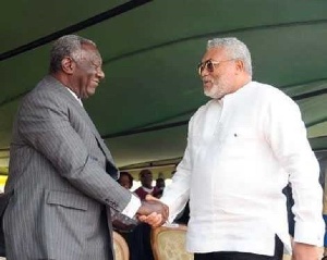 John Agyekum Kufuor exchanging pleasantries with Jerry John Rawlings