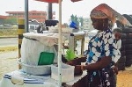 A trader vending local porridge known as koko