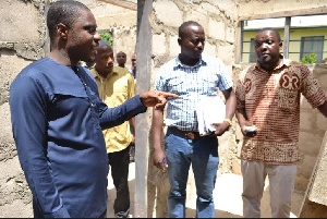DCE for Kwahu East, Isaac Agyapong with others during their visit to an ongoing project site