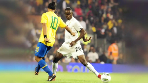 Albert Adomah (R), dribbling past Ronaldinho (L) back in 2011