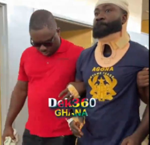 Okatakyie Afrifa (R) being escorted with a hospital during his arrest