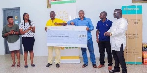 AngloGold Ashanti  Fifty 50 Club presenting the cash to one of the beneficiaries