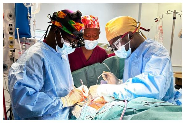 Group of doctors performing the first Coronary Artery Bypass Surgery at the UGMC