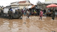Stranded residents being rescued by soldiers