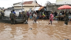 Stranded residents being rescued by soldiers