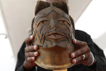 South Africa returns looted Zimbabwean remains and sacred artefact