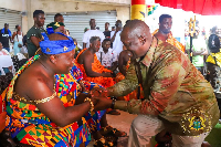 Minister of Lands and Natural Resources exchanging pleasantries with a chief