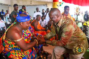 Minister of Lands and Natural Resources exchanging pleasantries with a chief
