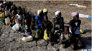 Women and children wait to be registered prior to a food distribution carried out by UN's WFP