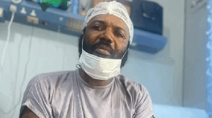 This recent photo shows William Ato Essien frail and in a hospital