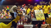 The masqueraders marched through town with flyers, and banners of the competition