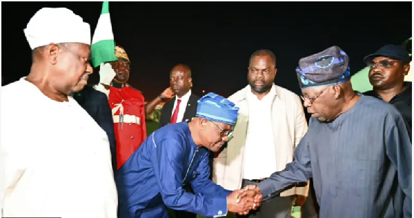 FCT Minister Nyesom Wike bow down dey shake President Bola Tinubu hand