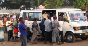 File photo of passengers struggling for a car