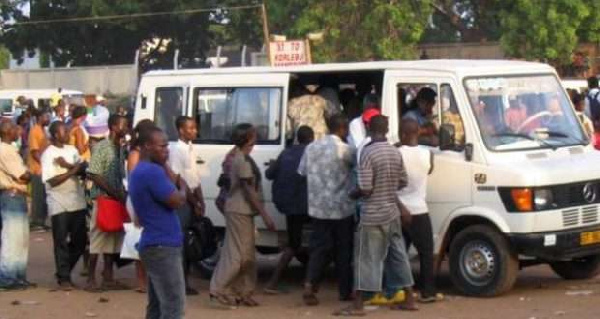 File photo of passengers struggling for a car