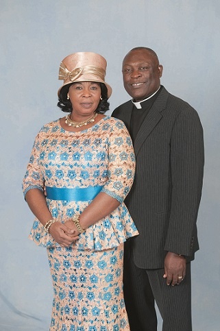 Apostle Kusi poses with the wife