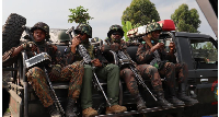 Soldiers are seen on a vehicle in Sake, Easte (DRC) on February 11, 2024