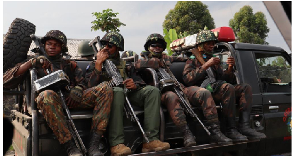 Soldiers are seen on a vehicle in Sake, Easte (DRC) on February 11, 2024