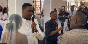 A photo of newly weds Mandy and George with Dr. Ofori Sarpong