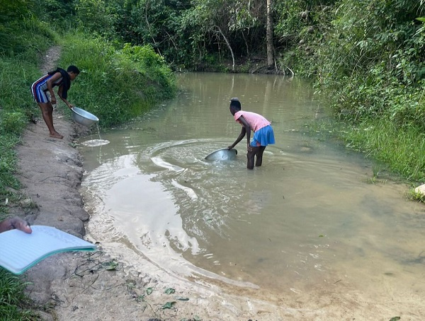 A girl  at the stream in Achonwa in Ahanta West district of Western Region